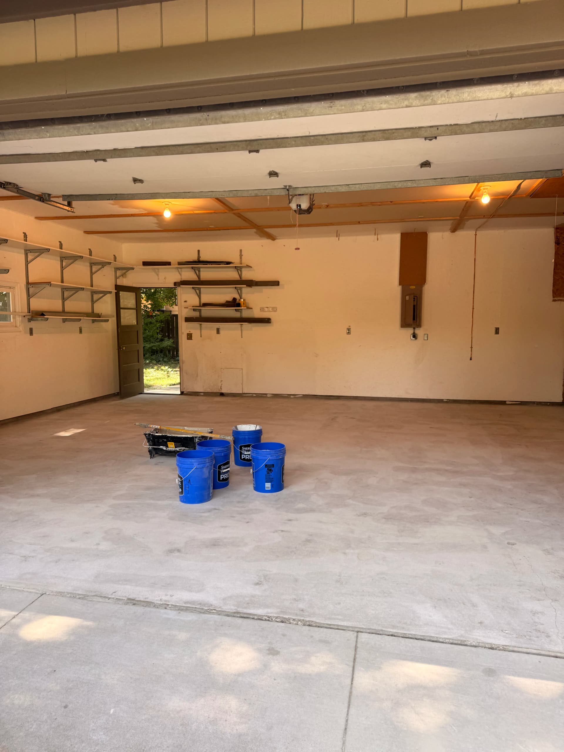 New Home Garage Makeover with Epoxy Flooring and Bold Wall Paint image